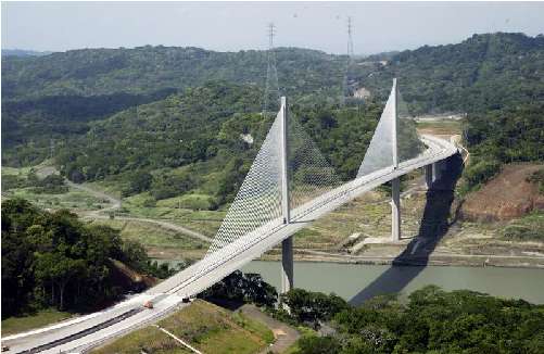 Arial view of the light colored Centennial Bridge across the Panama Canal
